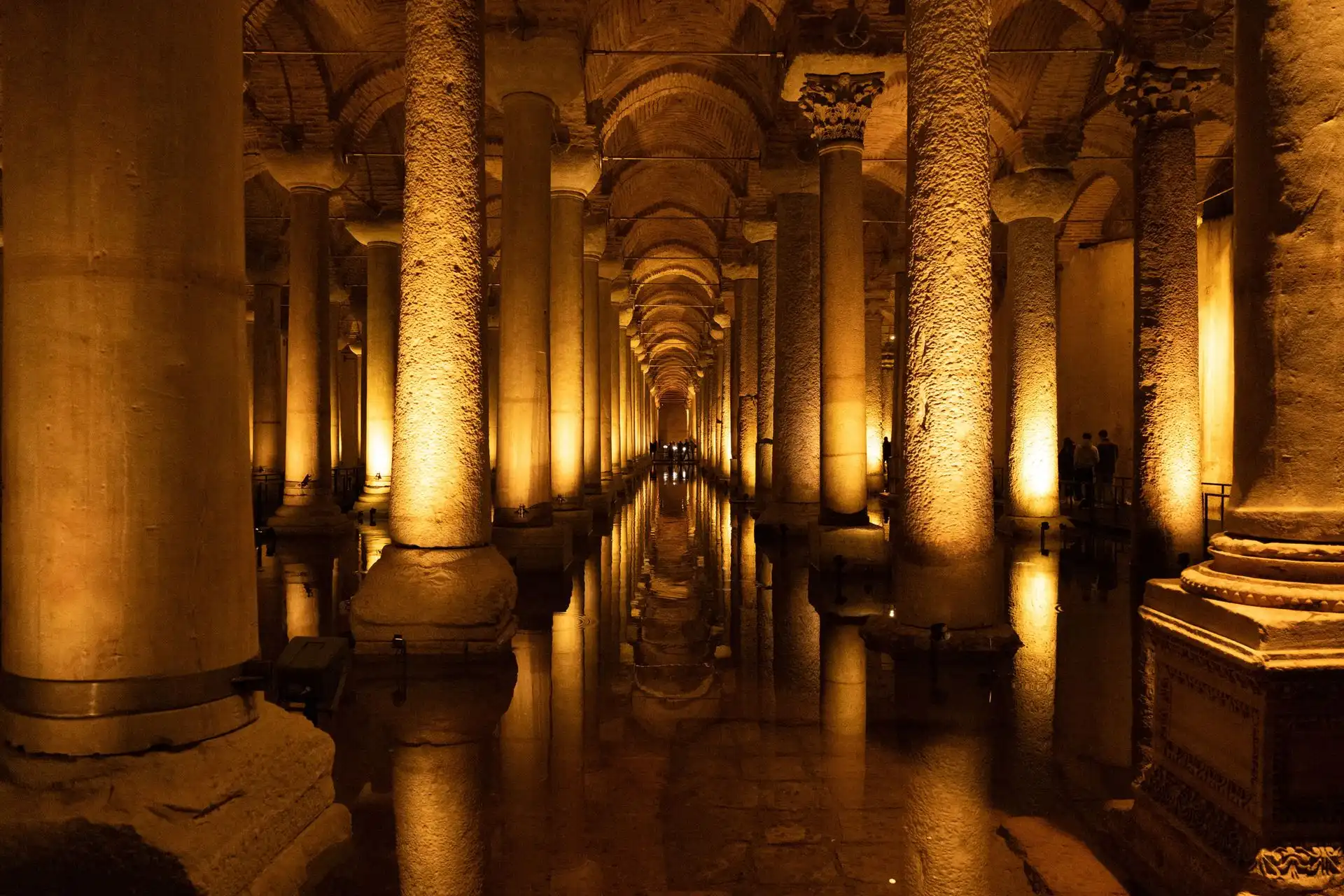The walkway between the illuminated columns of the Basilica Cistern