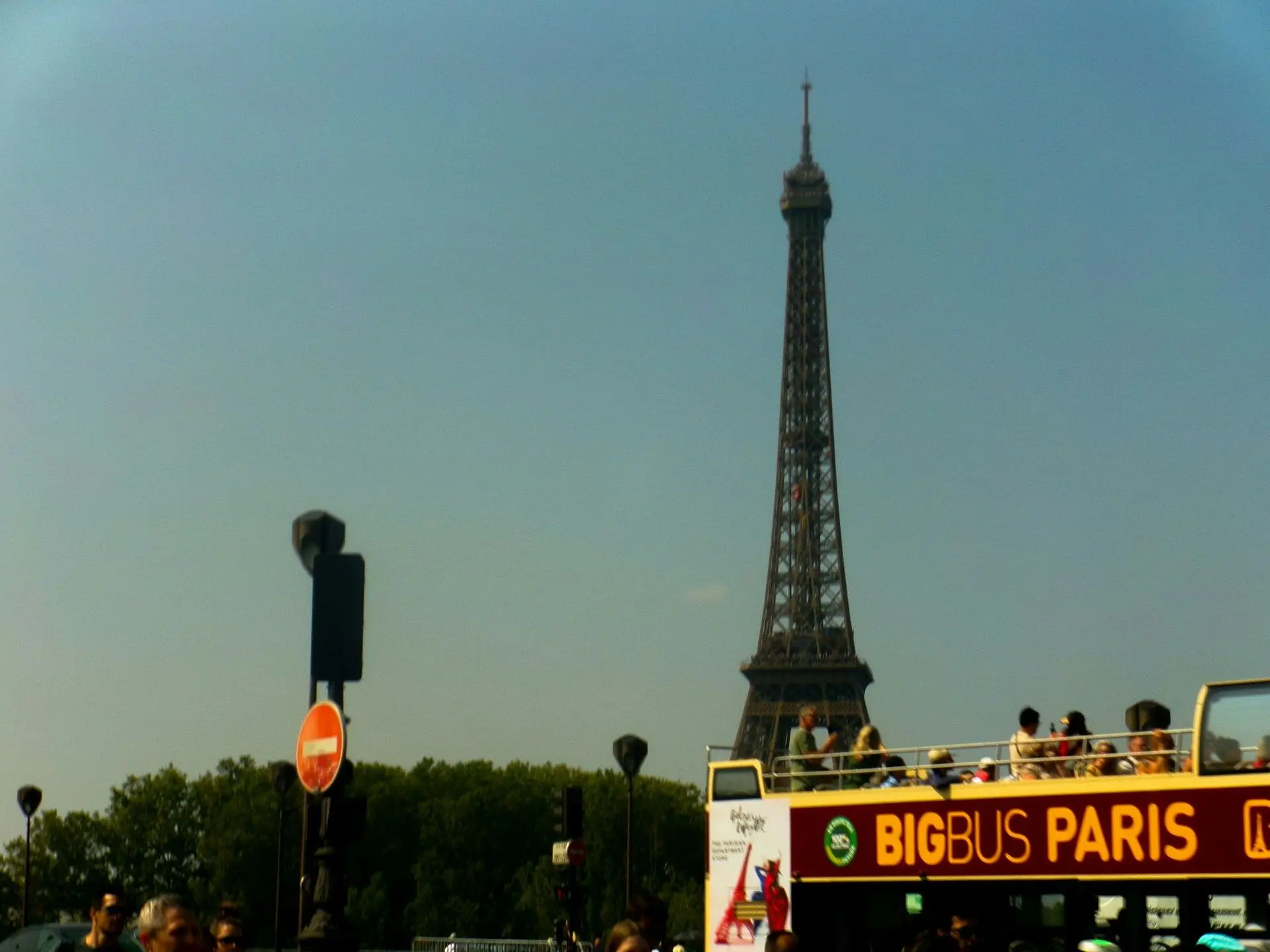 Open-top tour bus in Paris near the Eiffel Tower