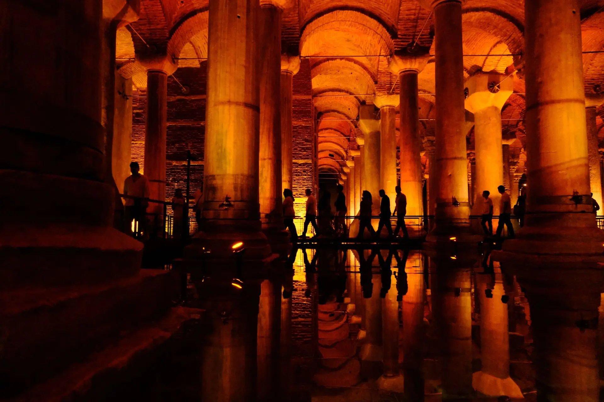 Visitors walking along the elevated walkway in the Basilica Cistern Visitors walking along the elevated walkway in the Basilica Cistern